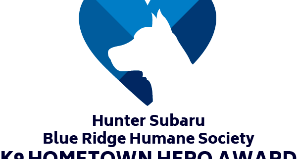 outline of dogs head in blue heart