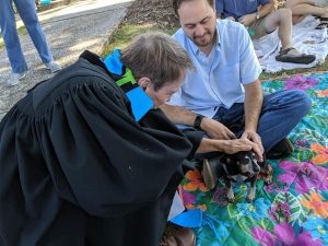 a roped clergy pets small dog