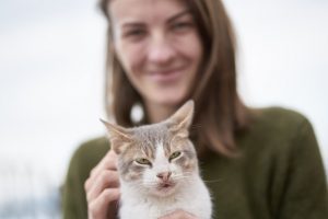 a women hold a cat