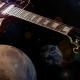 A guitar surrounded by planets