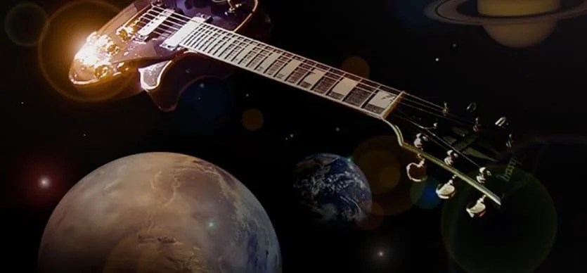 A guitar surrounded by planets