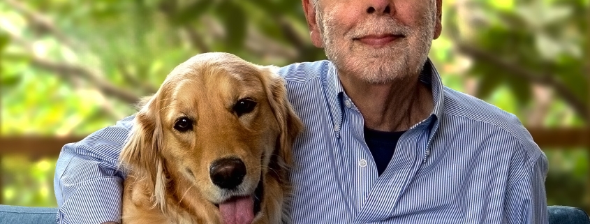 a man and dog pose together